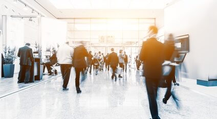 blurred people at a trade fair